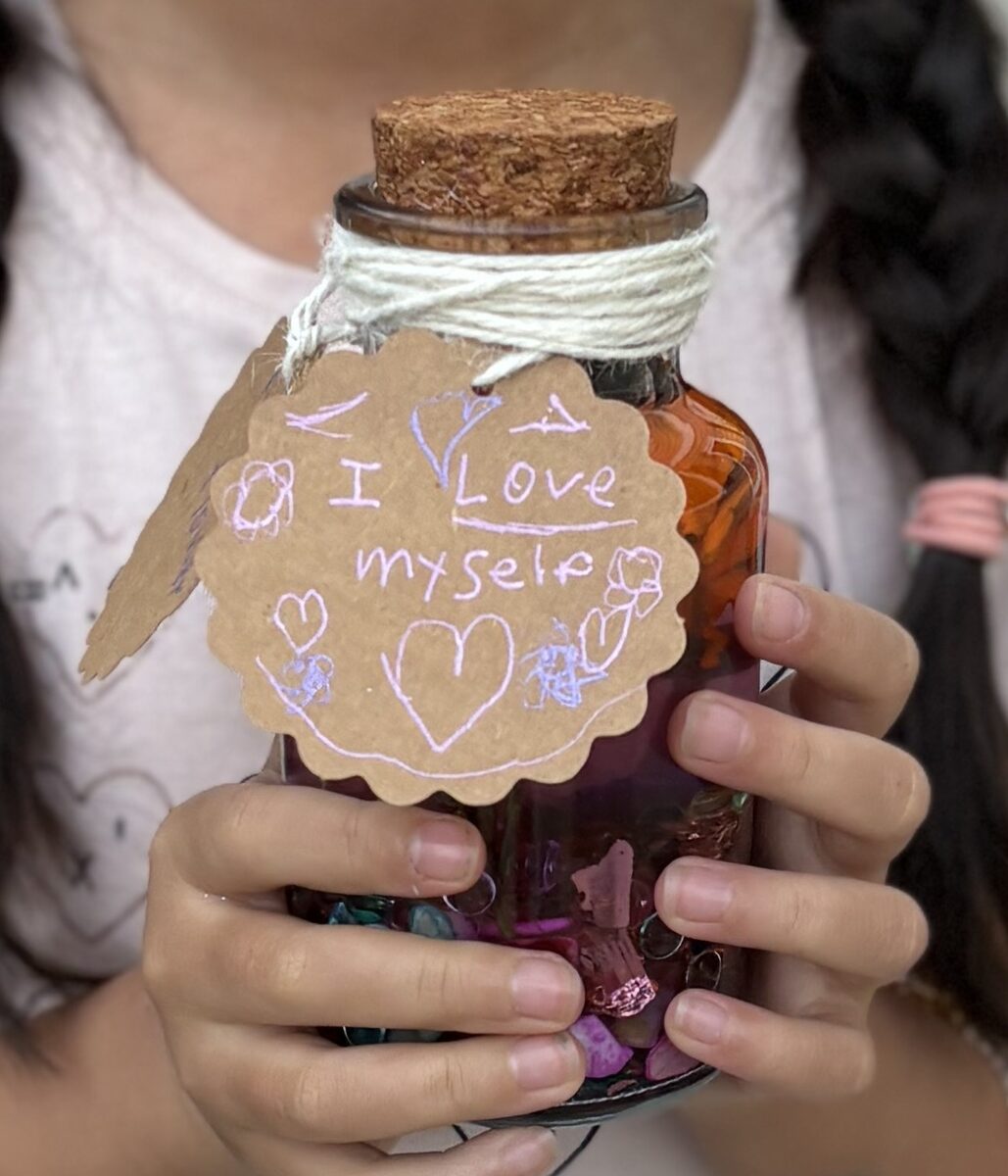 A handmade crystal jar craft with a tag that says 'I love myself'