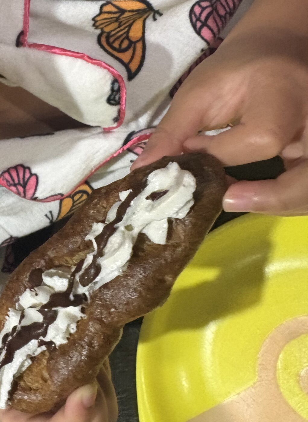 The finished pop, dipped in whipped cream and chocolate